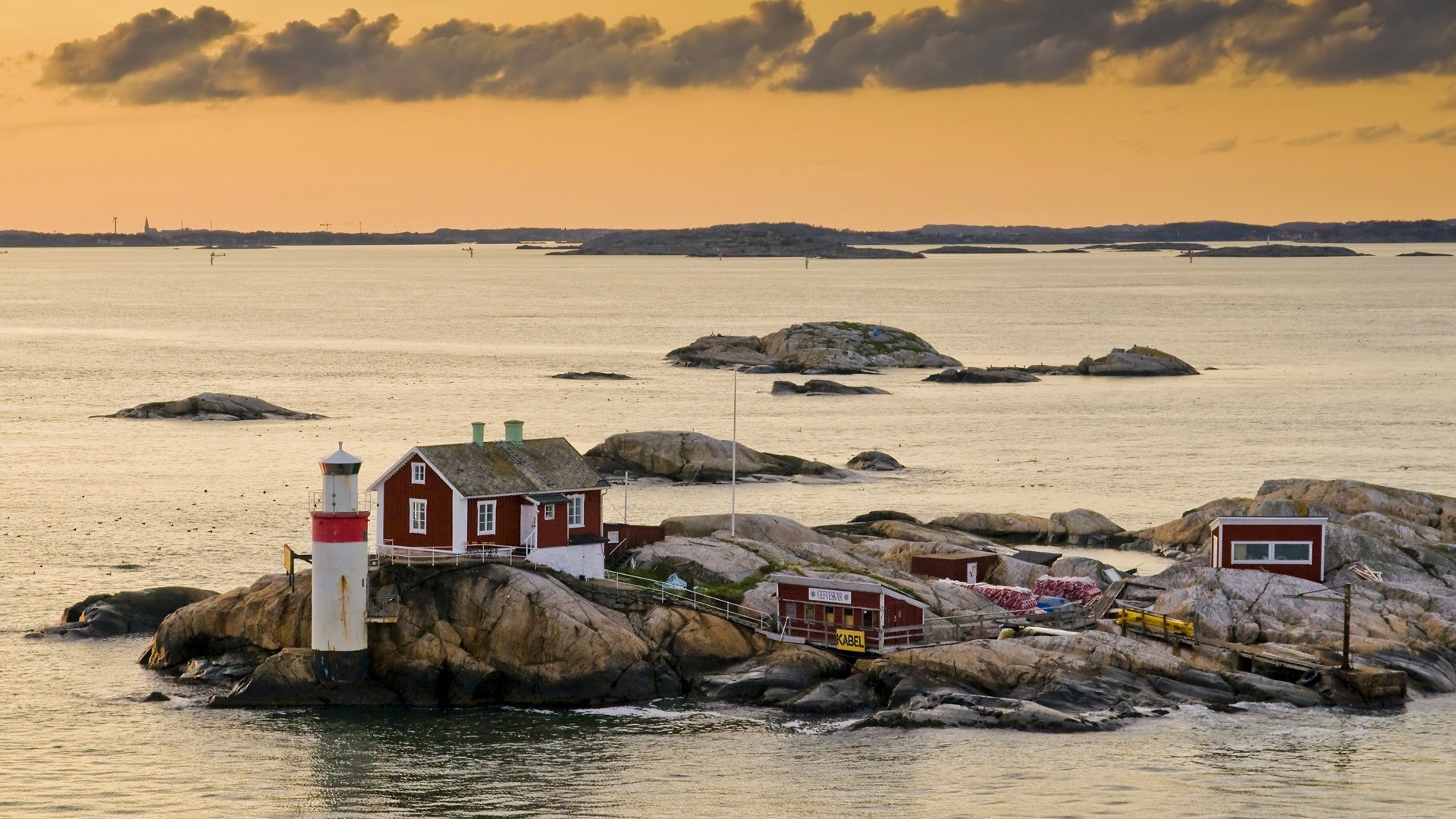 lighthouses-wonderful-little-lighthouse-sweden-bay-rocks-clouds-lighthouses-photos